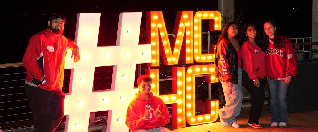 Attendees gather around the #MCHC light-up sign